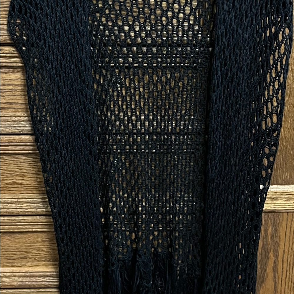 Torrid black cardigan with fringe, no tag for size but it’s a medium/large